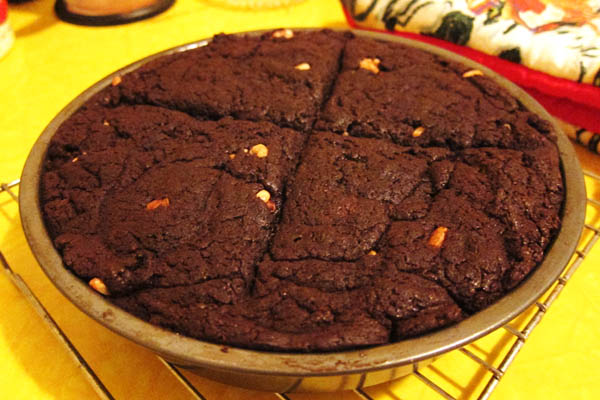 Four huge brownies with walnuts